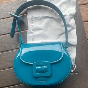 Blue patent leather bag. New with duster bag included.